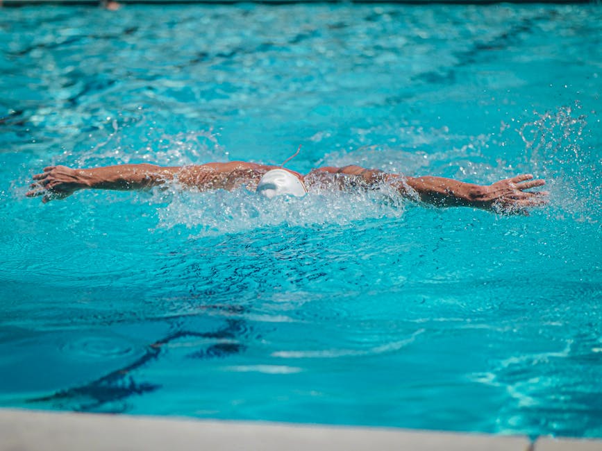 Swimmer in action in an olympic swimming pool